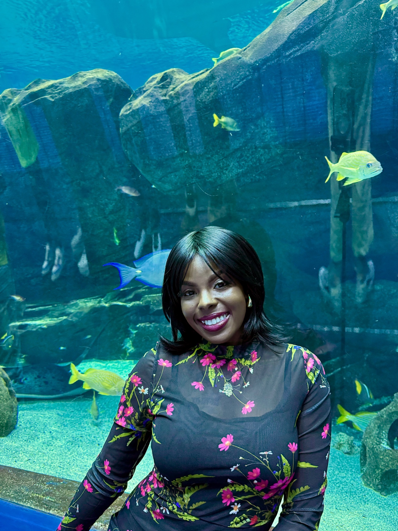 Haadiyah smiling at the aquarium